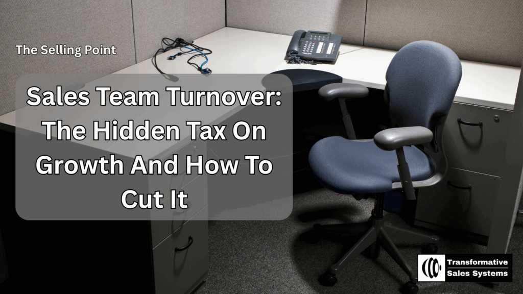 Empty office cubicle with a vacant chair, desk phone, and disconnected cords, symbolizing sales team turnover.